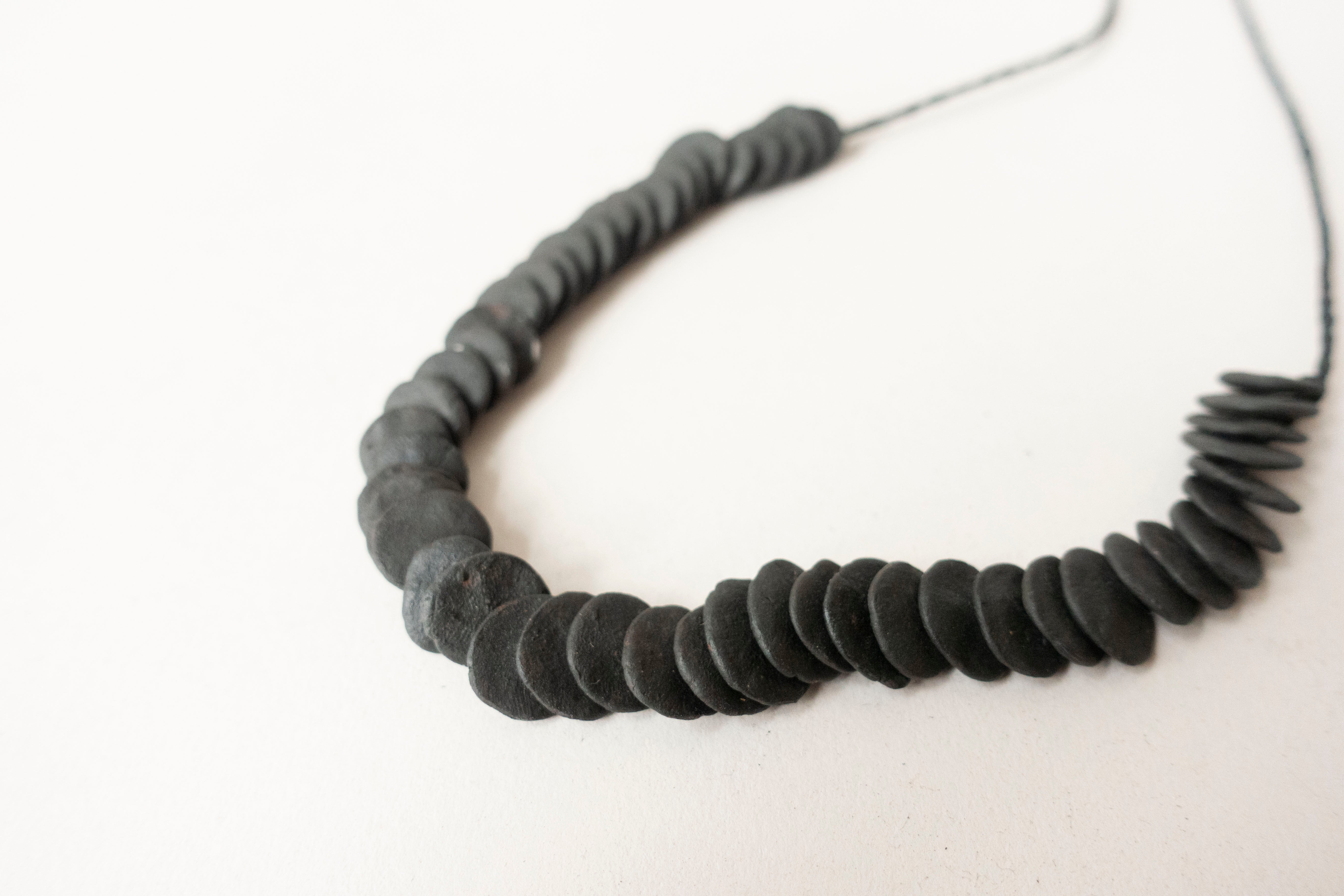 Woven necklace disc