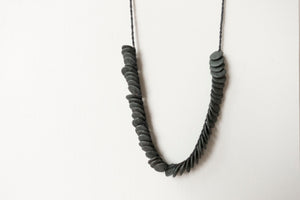 Woven necklace disc